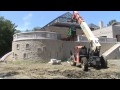 Using a JLG Forklift to lift a Bobcat Skidsteer